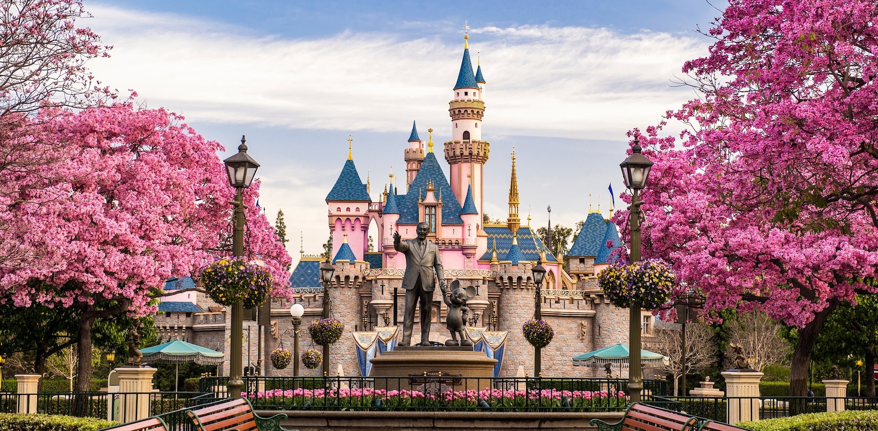 a large castle-like building with a statue in front of it